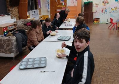 Young people baking around the long tables in the main hall