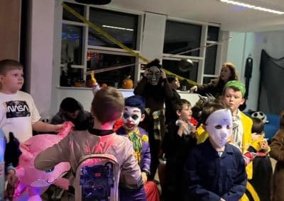 Children in masks and fancy dress at the Halloween party
