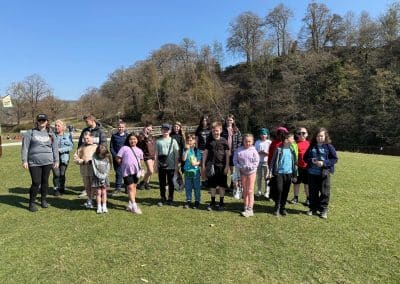 Children and staff gathered in a field in the Yorkshire Dales